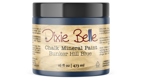 Jar of Dixie Belle Chalk Mineral Paint in Bunker Hill Blue color on a white background