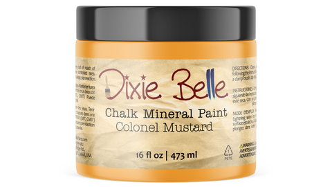 Jar of Dixie Belle Chalk Mineral Paint in Colonel Mustard color on a white background