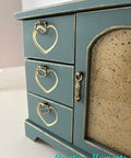 Small wooden jewelry chest with heart-shaped details on a white background, featuring 'Creative Moments' branding.