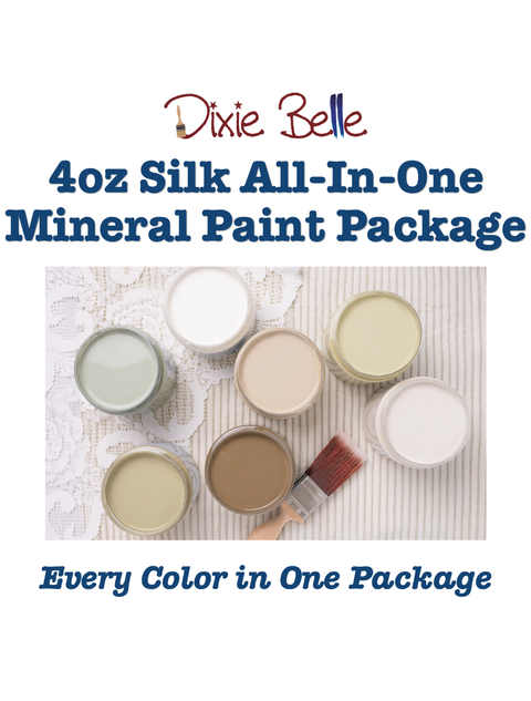 Promotional graphic for the Dixie Belle 4oz Silk All-In-One Mineral Paint Package, featuring text over a photo of multiple open paint cans in different colors saying "4oz Silk All-In-One Mineral Paint Package" and "Every color in one package" and a paintbrush on a striped fabric background.