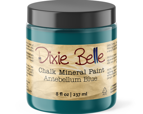 Jar of Dixie Belle Chalk Mineral Paint in Antebellum Blue on a white background
