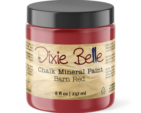 Jar of Dixie Belle Chalk Mineral Paint in Barn Red on a white background