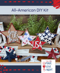 All-American DIY Kit: Decorative stars with patriotic designs on a wooden surface, featuring the text 'home of the brave' and 'USA'.