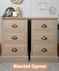 Two wooden nightstands with brass handles in a room setting, featuring the brand 'Cherubs Chalks Interiors'.