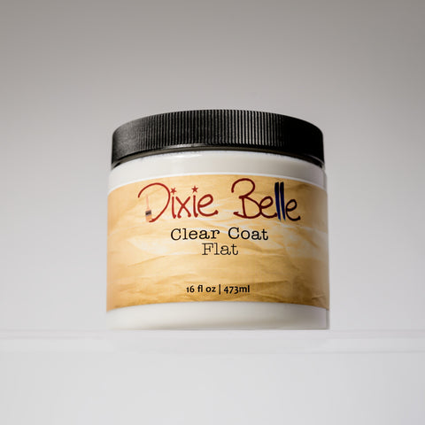 A 16 fl oz (473 ml) jar of Dixie Belle Clear Coat Flat with a black lid and a beige label, displayed against a plain light background.