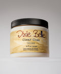 A jar of Dixie Belle Clear Coat Gloss with a black lid and beige label, containing 16 fl oz (473 ml) of product, is displayed against a plain, light background.