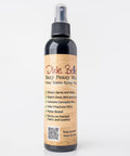A bottle of Dixie Belle Paint Company Easy Peasy Wax Clear Matte Spray Wax is standing upright against a plain white background. The label highlights its features.