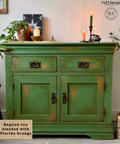 Green cabinet with decorative items in a room setting, featuring 'Faff designs' branding. Labeled "English Ivy blended with Florida Orange."