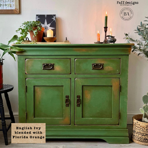 Green cabinet with decorative items in a room setting, featuring 'Faff designs' branding. Labeled "English Ivy blended with Florida Orange."