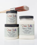Three jars of Dixie Belle Eggshell Gator Hides with a brush on a white background
