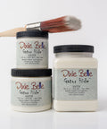 Three jars of Dixie Belle Satin Gator Hide with a brush on a white background