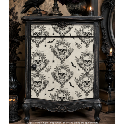 A gothic-style cabinet with a dark carved frame and a cream door covered in a black skull and ornate floral pattern, shown in a styled interior setting with candles and decorative objects.