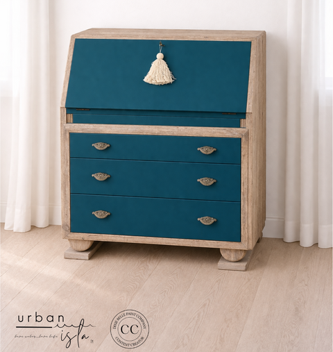 Blue dresser with beige accents against a white curtain background