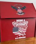 Red box with patriotic design featuring an eagle, American flag, and text on a wooden surface.