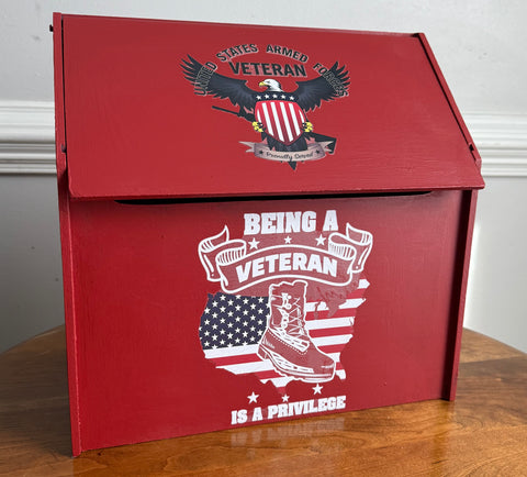 Red box with patriotic design featuring an eagle, American flag, and text on a wooden surface.