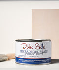 Dixie BellePicklin' White gel stain can with a brush and swatch on a gray background