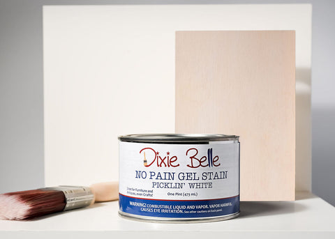 Dixie BellePicklin' White gel stain can with a brush and swatch on a gray background