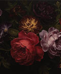 Dark floral arrangement with deep red, purple, and yellow flowers on a black background