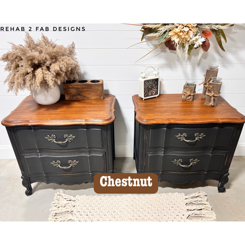 Two black nightstands with chestnut wood tops in a room setting.