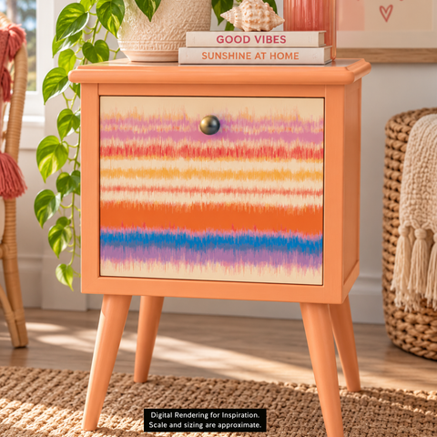 A peachy orange-colored wooden nightstand with a colorful striped decoupage on the front, shown in a styled room setting with a plant, books, and a woven chair. Label reads "Digital Rendering for Inspiration. Scale and sizing are approximate."