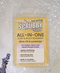 Scrubby Soap with lavender flowers on a soapy background