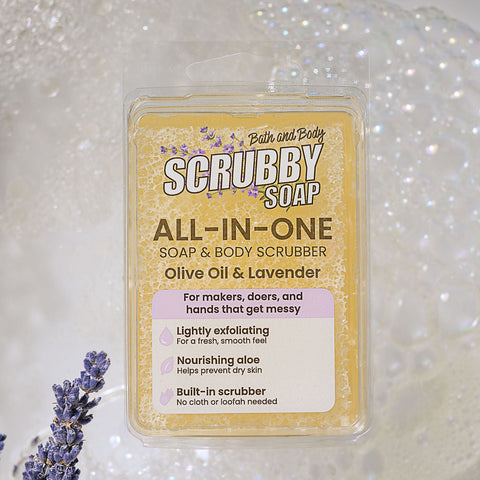 Scrubby Soap with lavender flowers on a soapy background