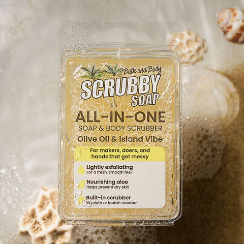 Scrubby Soap on a textured background with sand and shells