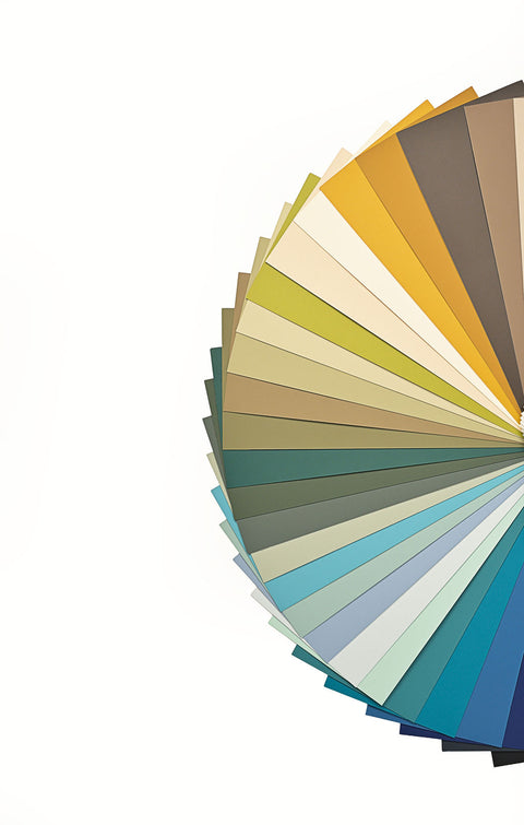 Color swatch wheel with various shades of green, blue, and brown on a white background