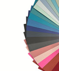 Color swatch cards with various shades of blue, green, gray, and pink on a white background