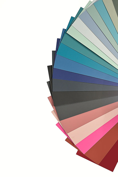 Color swatch cards with various shades of blue, green, gray, and pink on a white background