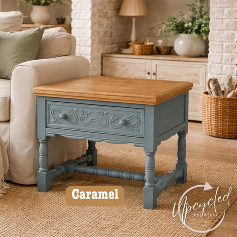 Wooden side table with blue base in a living room setting, featuring 'Upcycled by Nicci' brand.