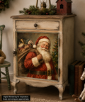 A vintage-style distressed wooden cabinet with a large Santa Claus portrait on the front door, shown in a decorated holiday room setting with a teddy bear on a chair, books, and a rocking horse.