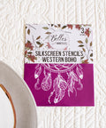 Silkscreen stencils packaging with boho design on a textured white surface