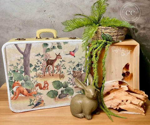 Belles and Whistles Woodland Nursery - A1 Rice Decoupage Paper.  Suitcase with Woodland Decoupage Rice paper applied with olive green rabbit and plant for staging