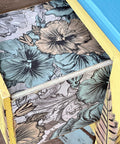 Belles and Whistles Blue and Yellow Floral - Rice Decoupage Paper is a simple way to visually enhance any surface of your project! View of the inside and outside of a drawer lined with Blue and Yellow Floral - Rice Decoupage Paper.