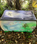 Belles and Whistles Fairies - Stencil provides an extra decorative touch to any project! Painted chest makeover in green, blue, purple and white creating a sky and grass scene. One fairy applied on top of the chest in purple. Two fairies applied on the front of the chest in teal and one in a copperish red. The Translucent Garden rub on furniture transfer was also applied throughout the piece and around the fairies.