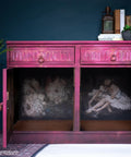 Belles and Whistles Floral Ballerina - A1 Rice Decoupage Paper is a simple way to visually enhance any surface of your project!
Hot pink credenza with both doors open displaying the Floral Ballerina - A1 Rice Decoupage Paper that covers the inside of furniture. Staged with greenery and books.