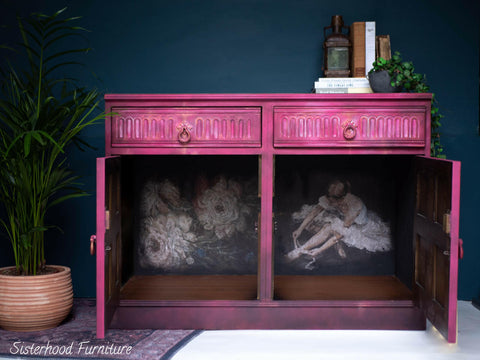 Belles and Whistles Floral Ballerina - A1 Rice Decoupage Paper is a simple way to visually enhance any surface of your project!
Hot pink credenza with both doors open displaying the Floral Ballerina - A1 Rice Decoupage Paper that covers the inside of furniture. Staged with greenery and books.