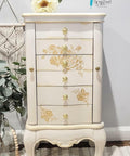 Belles and Whistles Floral - Silkscreen Stencil provides an extra decorative touch to your project!
Lingerie chest of drawer with Floral - Silkscreen Stencil on the front drawers. Staged with greenery.
