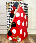 Belles and Whistles Houndstooth - Stencil provides an extra decorative touch to any project!
A file cabinet with half diagonally the cabinet in red with white polka dots and black mouse ears, on the other side is a white base with black Houndstooth - Stencil on top with black mouse ears with a red bow. In Between the two sides is a gold separator.