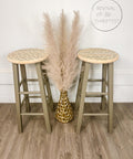 Belles and Whistles Mudcloth - Stencil provides an extra decorative touch to any project! Pair of stools painted in a light green with natural wood on the top and a stencil painted on. Staged with gold vase and wheat plants.