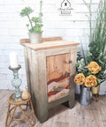 Belles and Whistles Mudcloth - Stencil provides an extra decorative touch to any project! Neutral chalk painted side table with a sunset painted on the front and raised stencil painted on it. Staged with florals and plants.