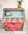 Belles and Whistles Native Rose - A1 Rice Decoupage Paper is a simple way to visually enhance any surface of your project! Red Chalk Painted secretary cabinet with sunflower transfers and teal inside with native rose decoupage. Staged with books and a plant.