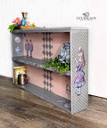 Belles and Whistles Patterns - Silkscreen Stencil provides an extra decorative touch to any project! Gray chalk painted book case with Alice rub on transfers and Polk a dot pattern stencil on the side. Staged with books and florals.