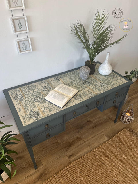 Grayish blue painted desk with the Distressed Damask Decoupage Paper applied on top. The Royal Damask stencil has been applied on top of the decoupage paper in the same grayish blue color.