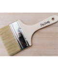 Belles and Whistles Big Daddy Brush. The Big Daddy Brush placed on a wooden background.