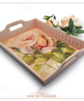 A pink serving tray featuring the Blushing Roses A1 Rice Decoupage Paper with the Bone Inlay Stencil applied on the edges and a small bouquet of pale pink roses, conveying a vintage and romantic aesthetic.