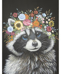 A whimsical painting of a raccoon with bright blue eyes and a crown of colorful flowers on its head. The background is solid black, making the raccoon's fur and the vibrant flowers stand out vividly.