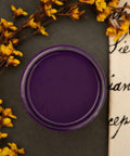 Dixie Belle Paint Amethyst Chalk Mineral Paint is the perfect paint for any DIY project! Open container of our beautiful deep purple Amethyst Chalk Mineral Paint displayed with flowers and script.