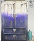 Dixie Belle Paint Amethyst Chalk Mineral Paint is the perfect paint for any DIY project! Painted cabinet fading from white to purple using our Amethyst Chalk Mineral Paint.